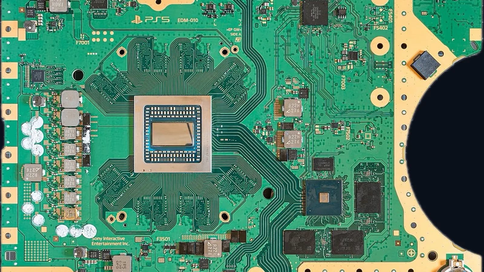 The main circuit board of a PlayStation 5, with the custom AMD processor at the centre.